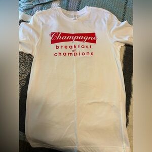 Champagne Breakfast of Champions Graphic Tee NWOT
100% Cotton